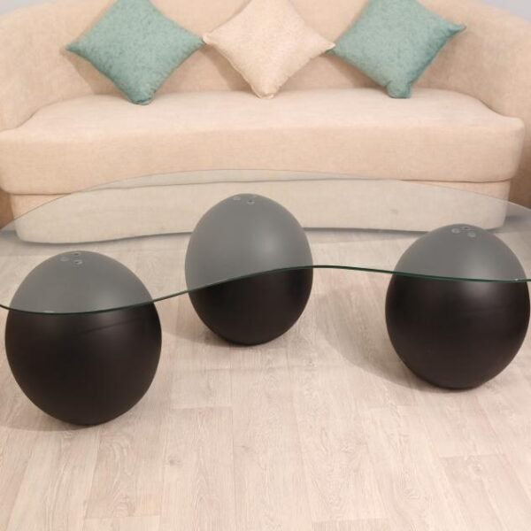 طاولة تقديم رخام صناعي  بشكل كرة لون أسود وسطح زجاج شفاف