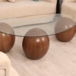 طاولة تقديم رخام صناعي بشكل كره لون بني وسطح زجاج شفاف