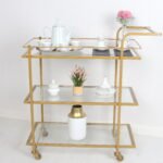 عربة تقديم ترلي ثلاثه دور لون ذهبي سطح زجاج